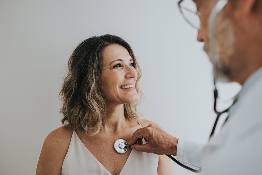 Woman getting heart check-up with doctor